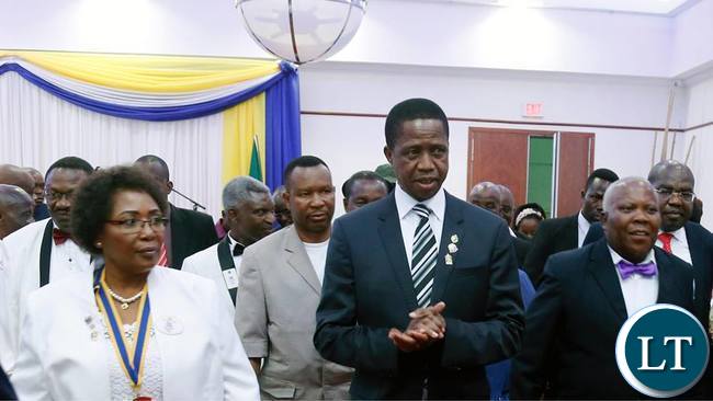 President Edgar Chagwa Lungu (cente) displays the badge he received from Lion 413 District Governor Jessica Chobe (left) on the right is Lions International Director Lion Hastings Eli Chiti during the Lion District 413 Zambia Fundraising for Melvin Jones Children Eye Referal Hospital at Pamodzi Hotel in Lusaka on Saturday,November 25,2017. SALIM HENRY/STATE HOUSE ©2017