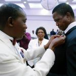 President Edgar Chagwa Lungu (cente) displays the badge he received from Lion 413 District Governor Jessica Chobe (left) on the right is Lions International Director Lion Hastings Eli Chiti during the Lion District 413 Zambia Fundraising for Melvin Jones Children Eye Referal Hospital at Pamodzi Hotel in Lusaka on Saturday,November 25,2017. SALIM HENRY/STATE HOUSE ©2017