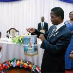 President Edgar Chagwa Lungu (cente) displays the badge he received from Lion 413 District Governor Jessica Chobe (left) on the right is Lions International Director Lion Hastings Eli Chiti during the Lion District 413 Zambia Fundraising for Melvin Jones Children Eye Referal Hospital at Pamodzi Hotel in Lusaka on Saturday,November 25,2017. SALIM HENRY/STATE HOUSE ©2017