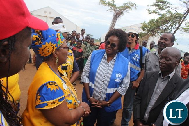 Lions Club Governor for District 413 Zambia, Ms Jess ica Choobe, handing over the donated materials to the refugee leader at Kenani refugee transit centre. Lions Club Governor for District 413 Zambia, Ms Jess ica Choobe, handing over the donated materials to the refugee leader at Kenani refugee transit centre.
