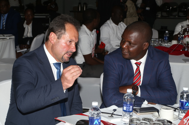 Airtel Chief Executive Officer Peter Correia confers with Ministry of Transport and Communication Director Communication Yese Bwalya during the launch of Airtel 4G network at Raddison Blu