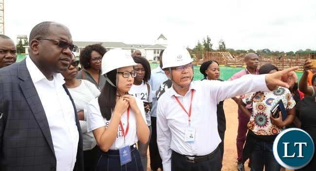 Levy Mwanawasa Hospital Director Physical planning Kakubelwa Mulalelo explains a point to Minister of Health Chitalu Chilufya whilst Permanent Secretary Cabinet office Stephen Mwansa listens during the tour of expansion works Levy Mwanawasa Hospita