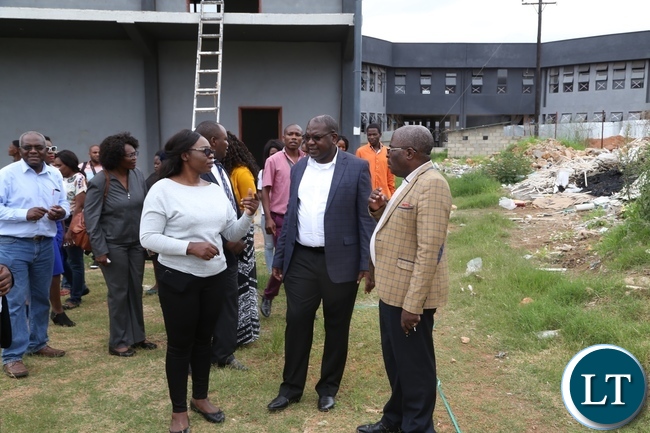 Levy Mwanawasa Hospital Director Physical planning Kakubelwa Mulalelo explains a point to Minister of Health Chitalu Chilufya whilst Permanent Secretary Cabinet office Stephen Mwansa listens during the tour of expansion works Levy Mwanawasa Hospital Levy Mwanawasa Hospital Director Physical planning Kakubelwa Mulalelo explains a point to Minister of Health Chitalu Chilufya whilst Permanent Secretary Cabinet office Stephen Mwansa listens during the tour of expansion works Levy Mwanawasa Hospital