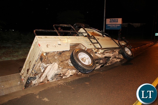 The driver of this vehicle escaped unhurt after the Toyota Landcruiser he was driving fell into the drainage due to over speeding along Lusaka road in Livingstone.Picture by KELVIN MUDENDA The driver of this vehicle escaped unhurt after the Toyota Landcruiser he was driving fell into the drainage due to over speeding along Lusaka road in Livingstone.Picture by KELVIN MUDENDA