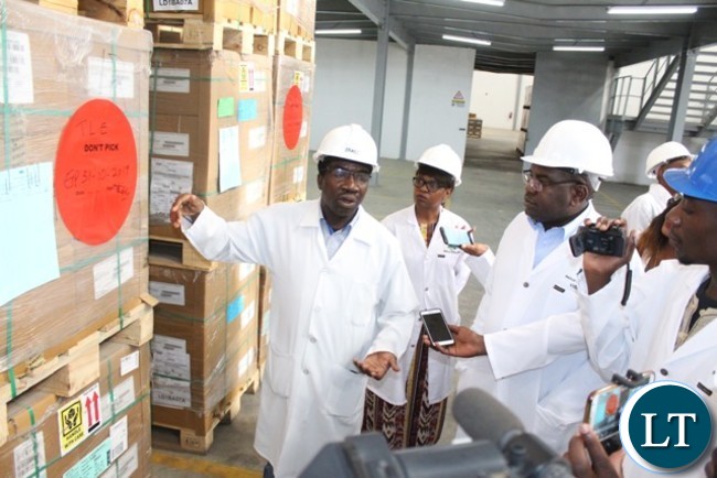 MEDICAL Stores Limited Warehouse Manager Ernest Sinyinda explains to Minister of Health Dr Chitalu Chilufya the availability of drugs at Medical Stores Limited in Lusaka yesterday during a conducted tour of the facility. Pictures By WEZI SIMBEYE/MINISTRY OF HEALTH