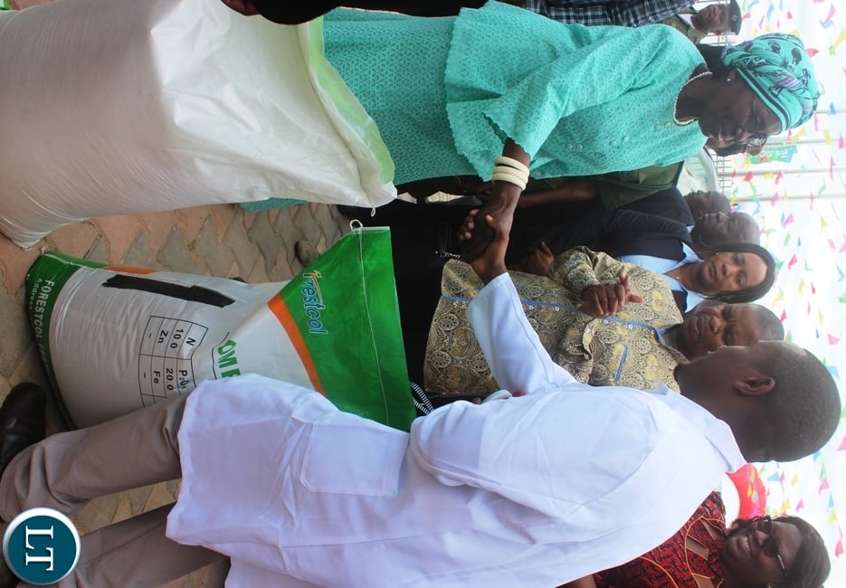 Vice President Inonge Wina receives bags of fertilizer from Nicolas Daka, forestcol Fertizer commercial Manager after opening the multi-million plant in Kabwe.Picture by SUNDAY BWALYA/ ZANIS