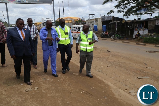 Special Assistant to the President for Project Implementations and Monitoring Andrew Chellah (c) with RDA member during the site visitation of the ongoing rehabilitation of Lumumba Road in Lusaka Special Assistant to the President for Project Implementations and Monitoring Andrew Chellah (c) with RDA member during the site visitation of the ongoing rehabilitation of Lumumba Road in Lusaka