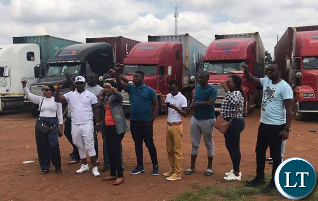 Patriotic Front cadres who yesterday impounded nine trucks loaded with Mukula logs pose for a victory Picture Patriotic Front cadres who yesterday impounded nine trucks loaded with Mukula logs pose for a victory Picture