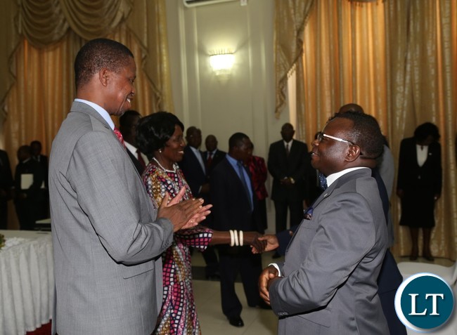 President Edgar Lungu talks to newly sworn in Constitutional Court Judge Justice Martin Musaluke at State House