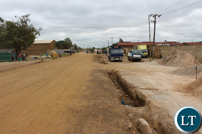 The photos show a site visit to John Liang by Investigation Officers from the Office of the Public Protector as evidence of demarcations and beacons placed in the said portion of the road.