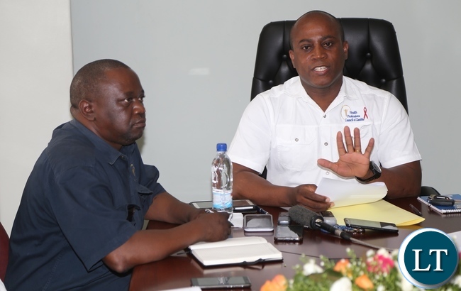 Health Professions Council of Zambia Chief Executive Officer Dr. Aaron Mujajati flanked by Health Professions Council of Zambia Chief operations Officer Kolala Mulenga (l) speaking to journalists during Health Professions Council of Zambia press briefing at there offices