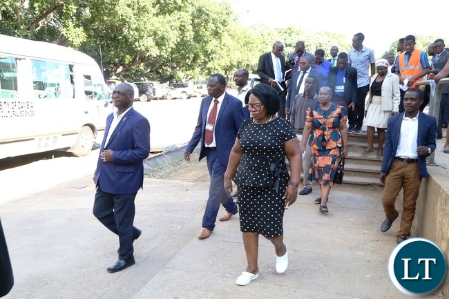 Minister of High Education Prof. Nkandu Luo (c) University of Zambia Vice Chancellor Prof. Luke Mumba (l) and the entourage during the tour and inspection of the hostels at UNZA