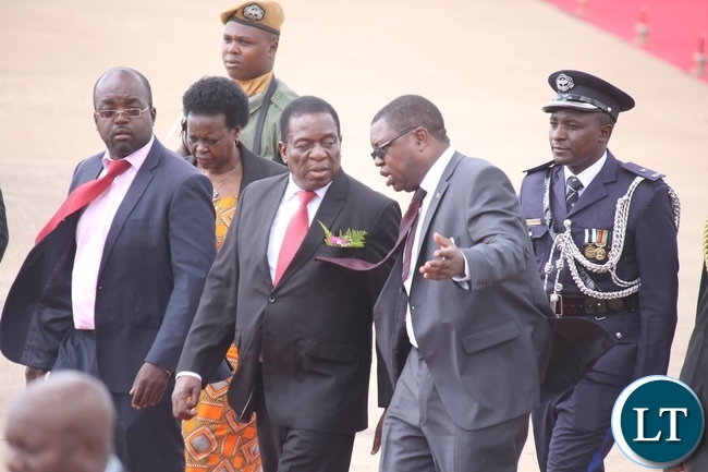Minister of Foreign Affairs Joseph Malanji welcomes President of Zimbabwe Emmarson Munagangwe shortly after his arrival at Kenneth Kaunda International Airport