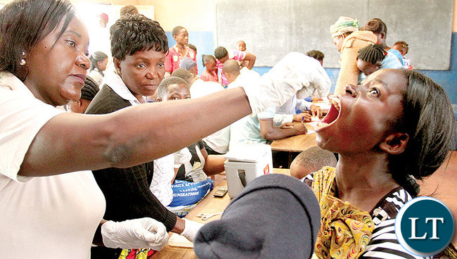 A WOMAN receiving a cholera vaccine in Lusaka’s Chawama township