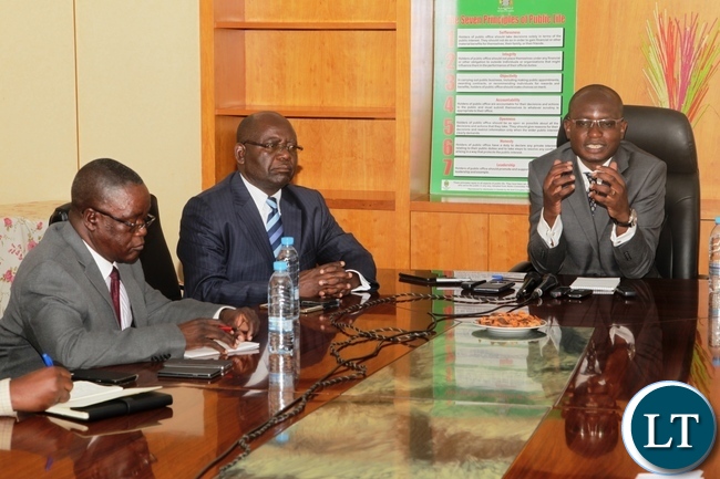 Special Assistant for Press and Public Relations to the President Mr Amos Chanda(right) stresses a point during a press briefing held at Ministry of Information and Broadcasting services board room .Looking on is The Ministry's Permanent Secretary Mr Godfrey Malama (centre) and Zambia News and Information Services Director Mr Patrick Lungu (left)