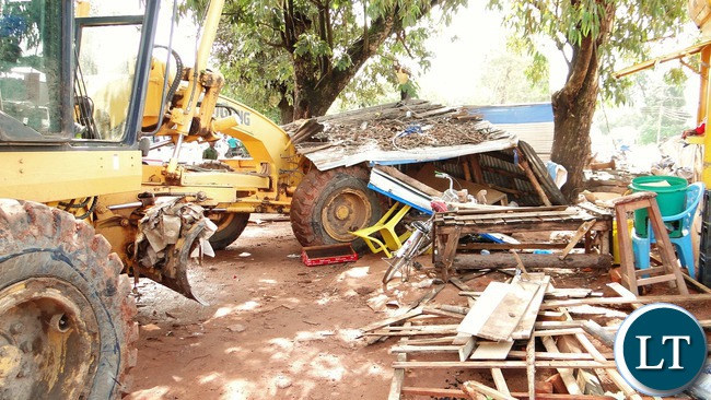 Business came to a standstill in Kasama today when a team of Council officers and state security swung into action and demolished all makeshifts in the central business area in a bid to prevent the outbreak of cholera. Independence road after the demolition exercise. -Picture by Mary Bwembya (ZANIS). Business came to a standstill in Kasama today when a team of Council officers and state security swung into action and demolished all makeshifts in the central business area in a bid to prevent the outbreak of cholera. Independence road after the demolition exercise. -Picture by Mary Bwembya (ZANIS).
