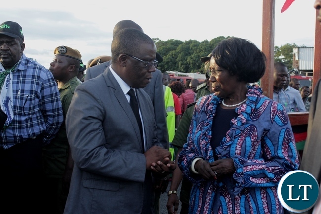Vice President Inonge Wina (r) confers with Western Province Minister Nathaniel Mubukwanu (l) on arrival at Mongu Airport for a two-day working visit to inspect government developmental projects in the province