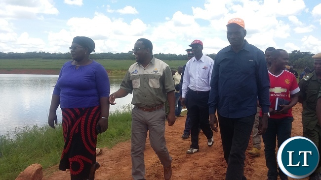 From (left) is central province PEO Jennifer Banda, Central province PS Chandra Kabwe and Serenje MP Maxwell Kabanda inspecting the dam where the six pupils from a nearby School drowned in. Picture by SUNDAY BWALYA/ZANIS