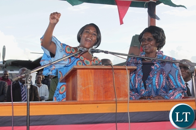 PF Deputy Secretary General Mumbi Phiri (l) raises the party symbol as Vice President Inonge Wina (r) Looks on arrival at Mongu Airport for a two-day working visit to inspect government developmental projects in Western Province PF Deputy Secretary General Mumbi Phiri (l) raises the party symbol as Vice President Inonge Wina (r) Looks on arrival at Mongu Airport for a two-day working visit to inspect government developmental projects in Western Province