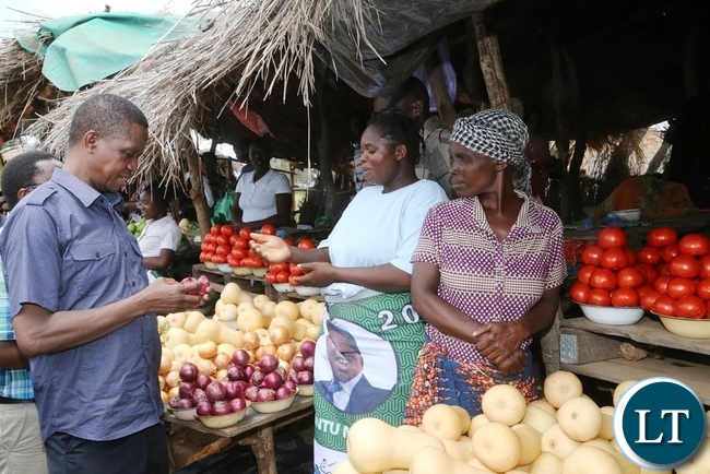 President Edgar Lungu intarects with marketers at John Chinena during the tour of Chibombo District in Central Province