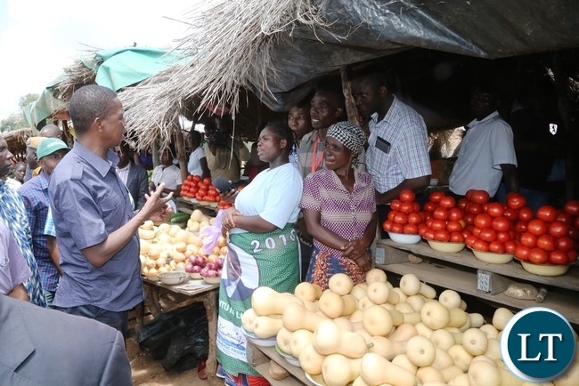 President Edgar Lungu intarects with marketers at John Chinena during the tour of Chibombo District in Central Province