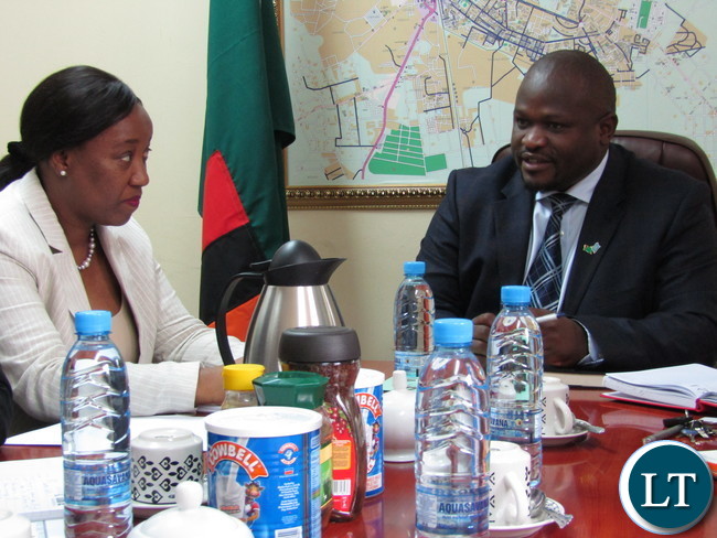 Africa Development Bank (ADB) Country Manager Mary Manneko Monyau with Minister of National Development Planning Alexander Chiteme