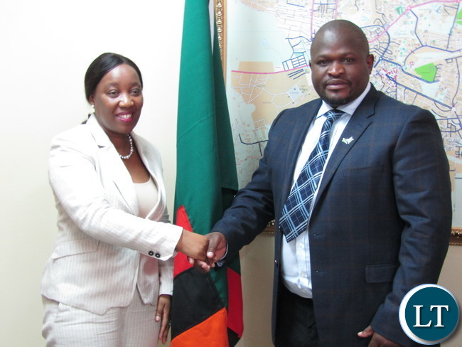 Africa Development Bank (ADB) Country Manager Mary Manneko Monyau with Minister of National Development Planning Alexander Chiteme