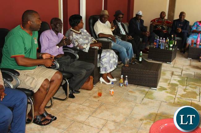 Mr Lusambo chatting with the Lamba Chiefs during a luncheon at his house in Ndola