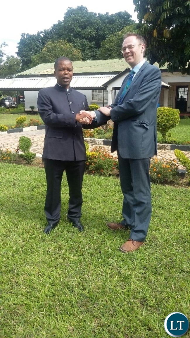 Scottish Minister for international development and Europe Dr Allasdair Allan presents a gift to Central Province Minister Sydney Mushanga when he paid a courtesy call on him in Kabwe Scottish Minister for international development and Europe Dr Allasdair Allan presents a gift to Central Province Minister Sydney Mushanga when he paid a courtesy call on him in Kabwe