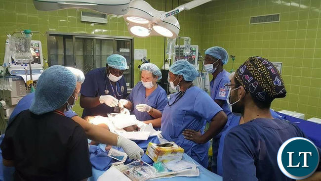 Surgeons hard at work separating the conjoined twins