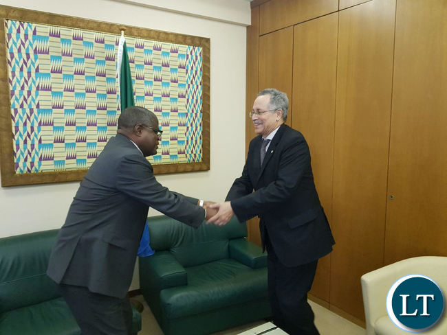 Commerce Minister, Christopher Yaluma shakes hands with African Caribbean Pacific Group of States (ACP) Secretary General His Excellency Dr. Patrick Gomes.