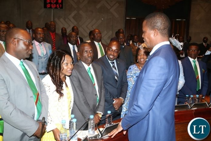 Minister of Gender Victoria Kalima confers with His Excellency President Edgar Lungu whilst other Ministers looks on shortly after State of the Nation address at Parliament Buildings