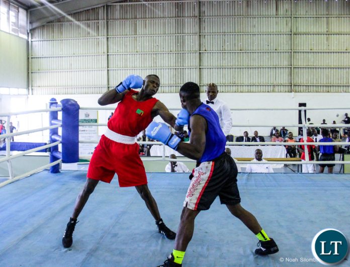 Benny Muziyo (Red) knocking out Malawian boxer Elias Kassim (Blue).Courtesy of OYDC
