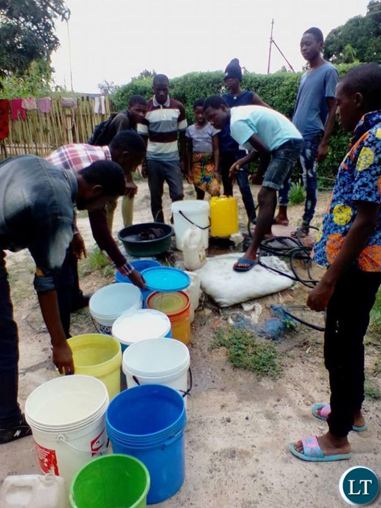 Mpatamatu residents drawing water from wells
