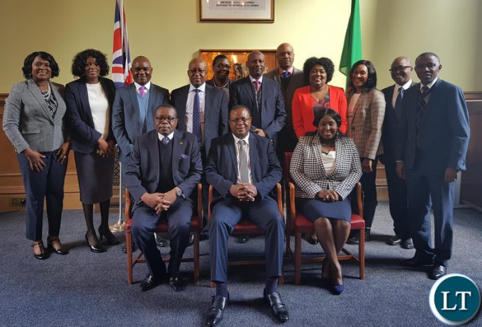 Zambia High Commission London Staff pose for a picture with Dr. Simwinga.