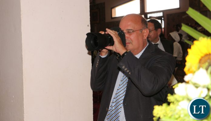 Italian ambassador to Zambia Filippo Scammacca getting pictures.