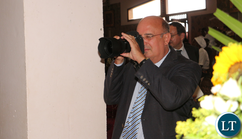 Italian ambassador to Zambia Filippo Scammacca getting pictures.