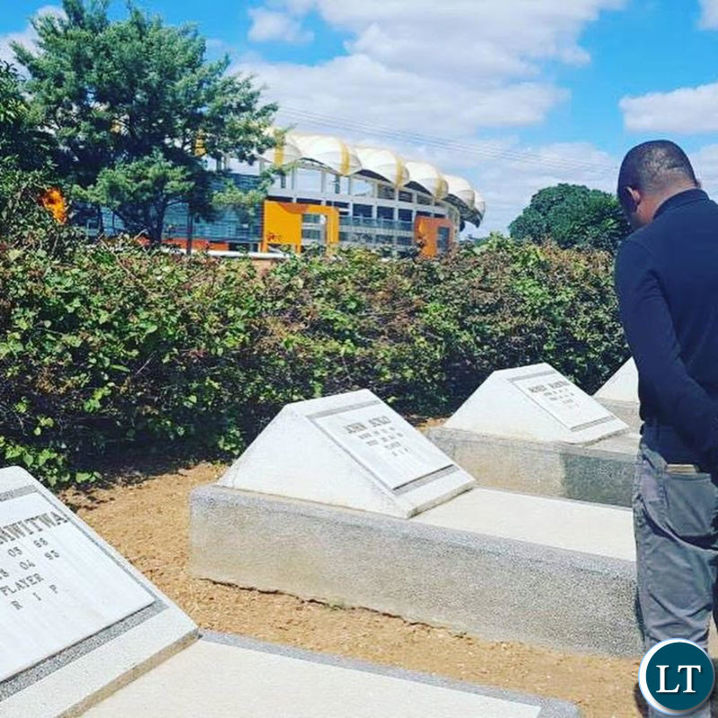 Kalusha Bwalya paying his respects to his fallen colleagues at Heroes Stadium