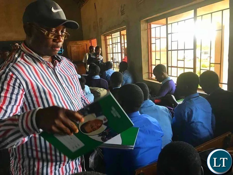 Kasama Member of Parliament Kelvin Sampa. donating books to Kapata Day Secondary School