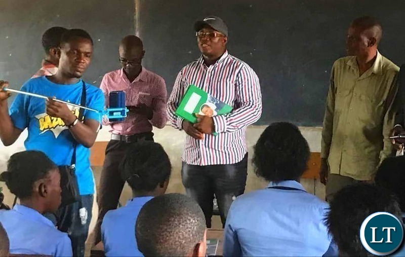 Kasama Member of Parliament Kelvin Sampa. donating books to Kapata Day Secondary School