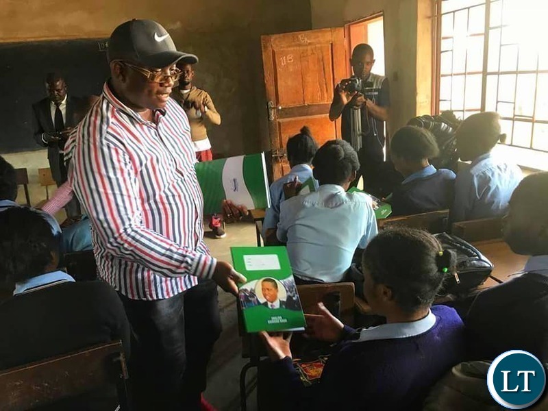 Kasama Member of Parliament Kelvin Sampa. donating books to Kapata Day Secondary School
