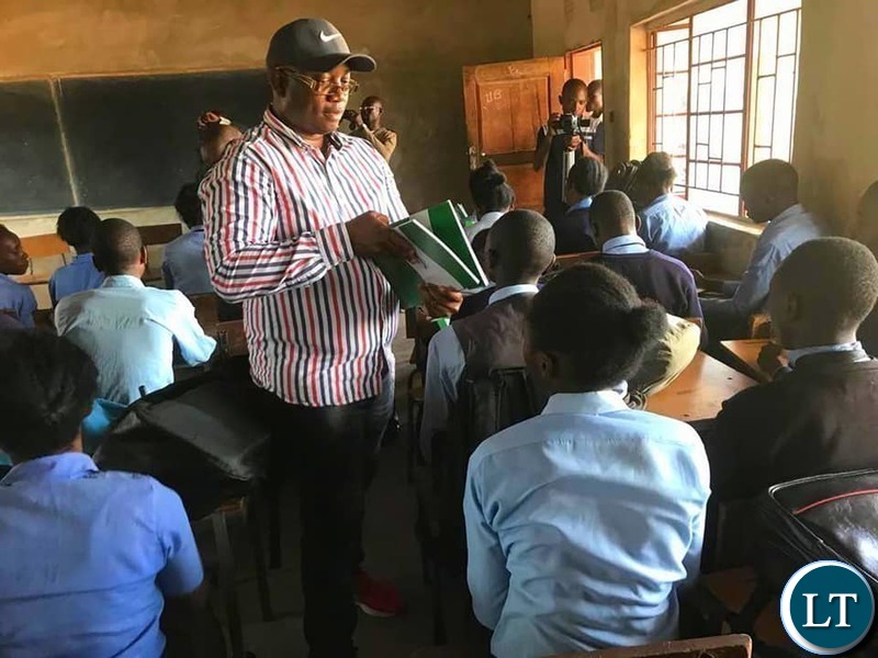 Kasama Member of Parliament Kelvin Sampa. donating books to Kapata Day Secondary School