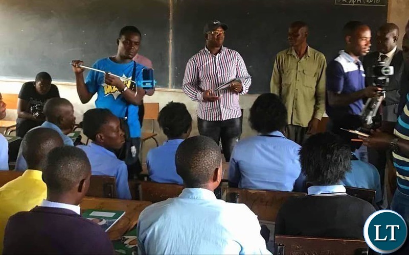 Kasama Member of Parliament Kelvin Sampa. donating books to Kapata Day Secondary School