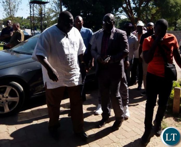 Mwanba accompanied by his father Chishimba Kambwili and his lawyer Christopher Mundia and other NDC officials. Mwanba accompanied by his father Chishimba Kambwili and his lawyer Christopher Mundia and other NDC officials.