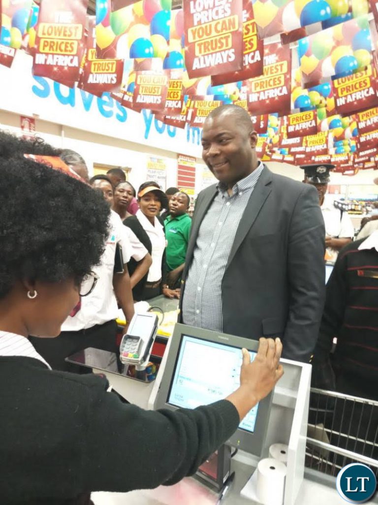 Lusaka Province Minister Mr Bowman Lusambo officiates at the official opening of Chirundu Shoprite Store.