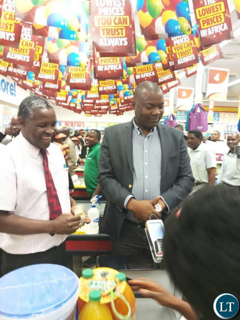 Lusaka Province Minister Mr Bowman Lusambo officiates at the official opening of Chirundu Shoprite Store.