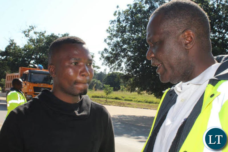 Works and Supply Minister Felix Mutati with Ministry Officials on the Street
