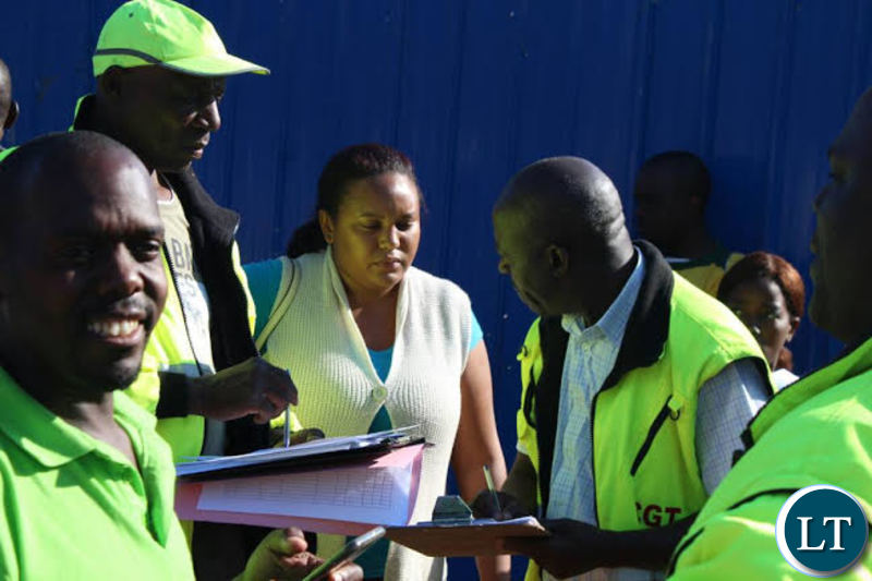 Works and Supply Minister Felix Mutati with Ministry Officials on the Street