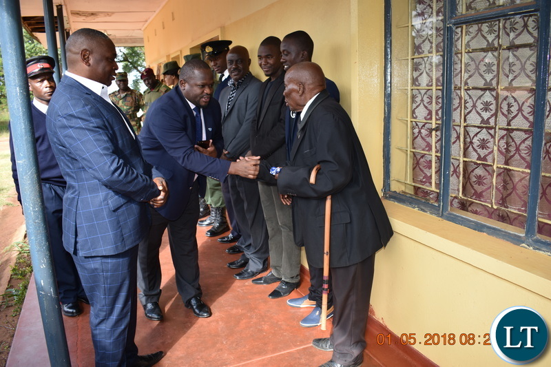 Senior citizen and Symbol of the Nation Mpundu ‘Zanco’ Mutembo welcoming Minister of National Development Planning Alexander Chiteme ahead of Labour Day Celebrations in Mbala on 1 May 2018. Mr. Mutembo is the man whose image is displayed at Lusaka’s Freedom Statue, as a symbol of Zambia’s freedom, depicting his breaking the colonial Government’s chain pre-Independence in 1963. – PHOTO | CHIBAULA D. SILWAMBA | MNDP