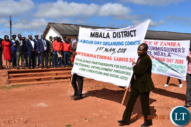 Workers marching past Minister National Development Planning Alexander Chiteme and other dignitaries during the Labour Day Celebrations in Mbala on 1 May 2018. – PHOTO | CHIBAULA D. SILWAMBA | MNDP
